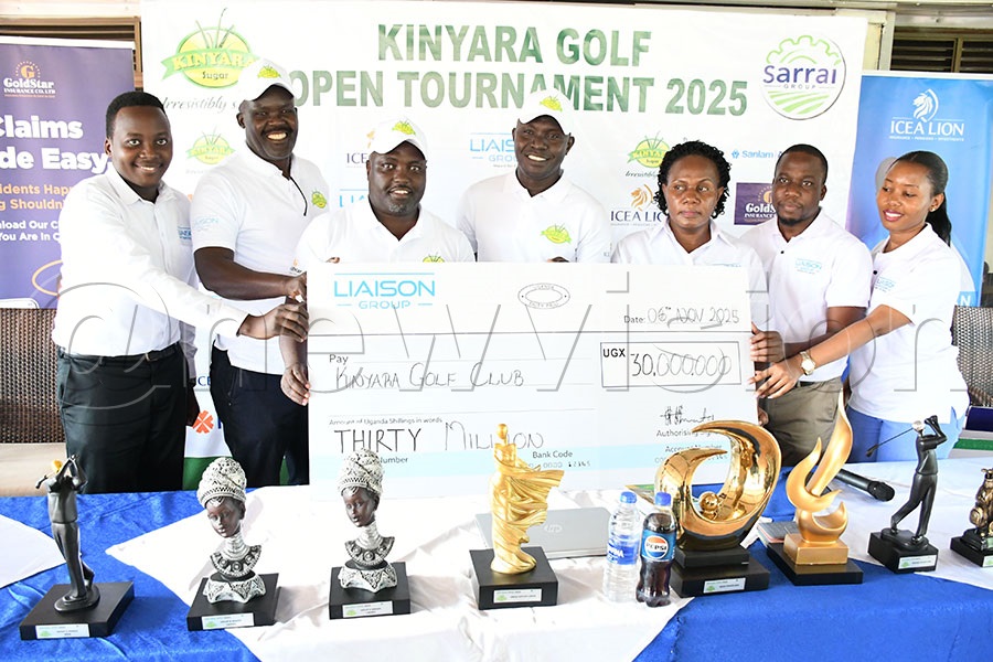 LIASON's Sarah Siryowe (3rd right) and her team present their sh30m cheque to Kinyara's team led by captain Moses Enzama (center) and PRO Francis Mugerwa (3rd left) at Kitante. Photo by Michael Nsubuga