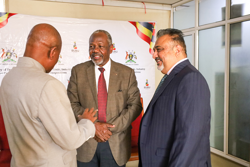 Eng. James Kalibala (centre) engages Minister of Trade Sanjay Tanna (right) and Gen. Mbadi (left) during the Standards Council meeting. (Courtesy)