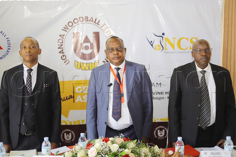 Uganda Woodball Federation President Paul Mark Kayongo (C), General Secretary Adam Kato (L) and Vice President Lukman Kirya (R) during the national anthem before the beginning of the assembly