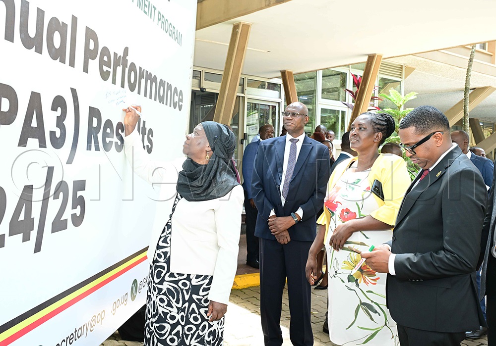Kampala Minister, Minsa Kabanda appending her signature the 3rd Annual Performance Assessment Results for Financial Year 2024/2025 launched at the Ministry of Finance, August 12, 2026. (Photo by Eddie Ssejjoba)