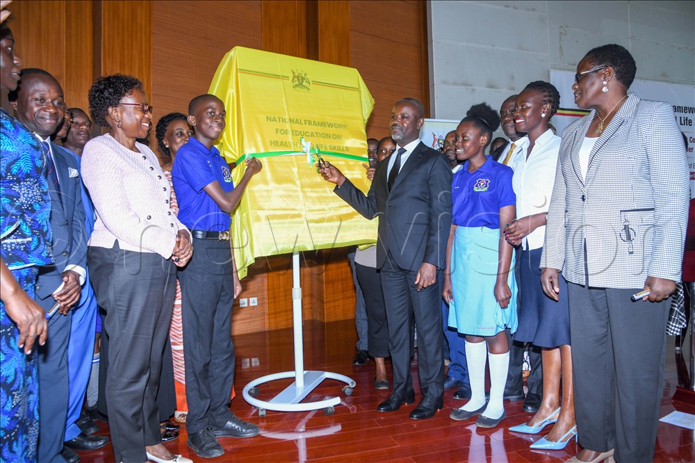 Deputy Speaker of Parliament Thomas Tayebwa launches the National Framework for Education on Health and Life Skills as Peter Ogwang State minister for Sports, government chief whip Ruth Achieng and Mercy Faith Lakisa State minister for Gender, Labour, and Social Development Youth and Children Affairs look on