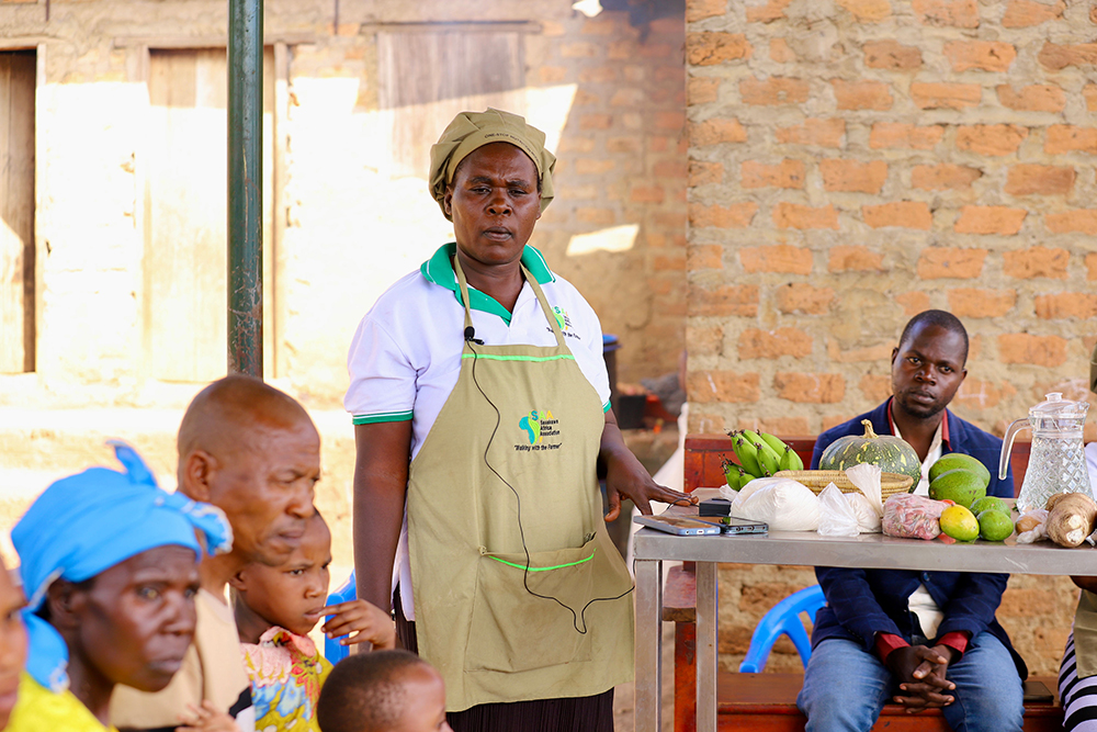 Nakibuule displaying the different food items that should be fed to malnourished children. (Courtesy)