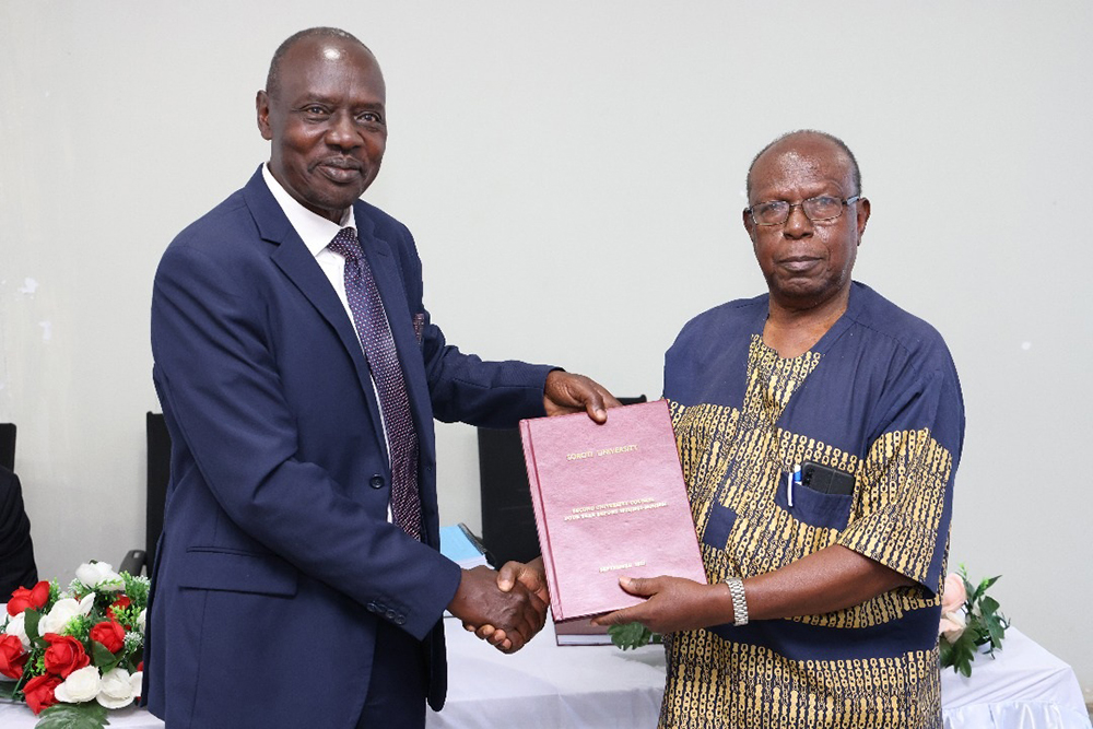 Prof. Pius Okong receiving Handover Report from the Chairperson of the Second University Council Engineer Dr Vincent B A Kasangaki. (Courtesy)
