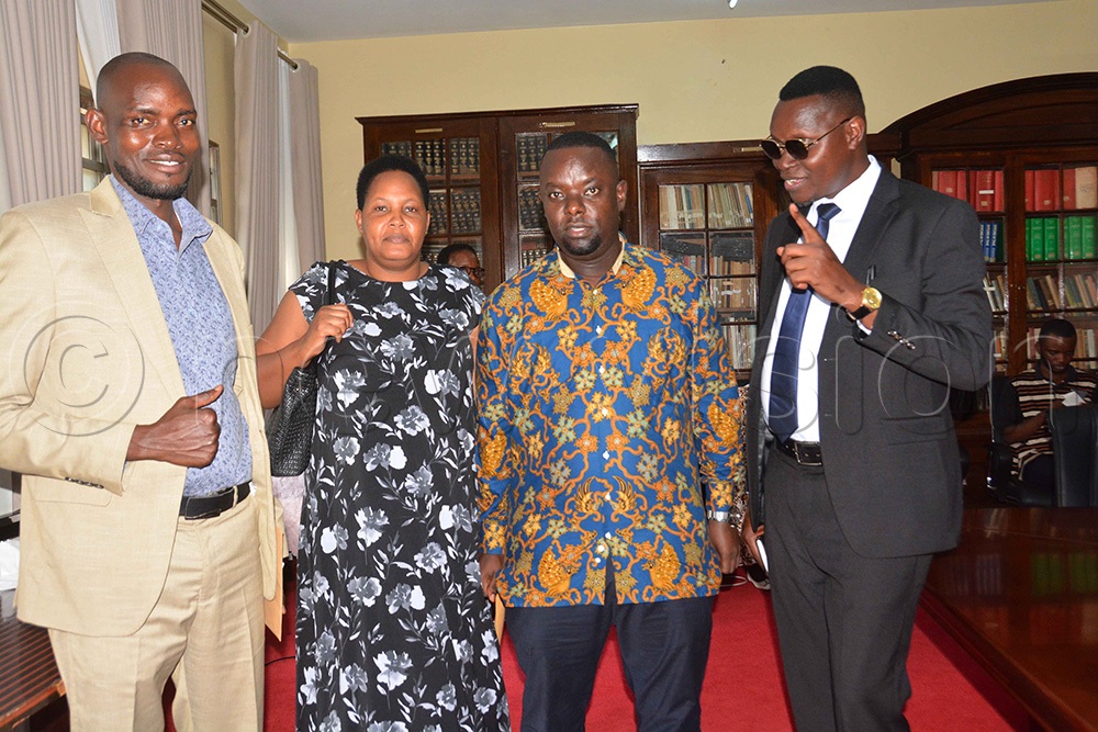 The RDC of Buyende District, Paul Mwidu (right), talks to his counterparts after a meeting with the Secretary to the President's Office about the trip to China at the President's Office in Kampala on Friday, October 23, 2026. (Photo by Francis Emorut)