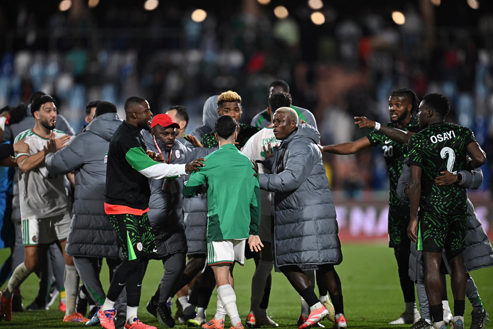 Algeria's and Nigeria's players argue during the Africa Cup of Nations (CAN) quarter-final football match between Algeria and Nigeria at the Grand stadium in Marrakesh on January 10, 2026. (Photo by Paul ELLIS / AFP)
