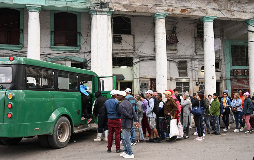Cubans line up to board a private transport minibus in Havana on February 6, 2026. (AFP)
