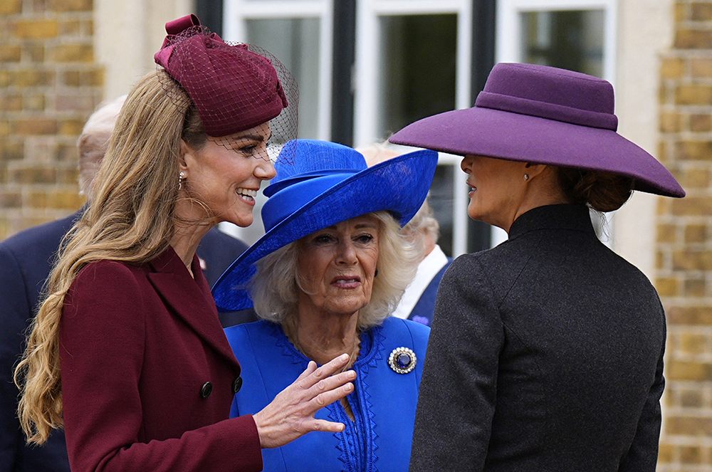 Britain's Queen Camilla and Britain's Catherine, Princess of Wales talk with US First Lady Melania Trump upon her arrival in the grounds of Windsor Castle, in Windsor, on September 17, 2025, for the start of a second State Visit. (Credit: AFP)