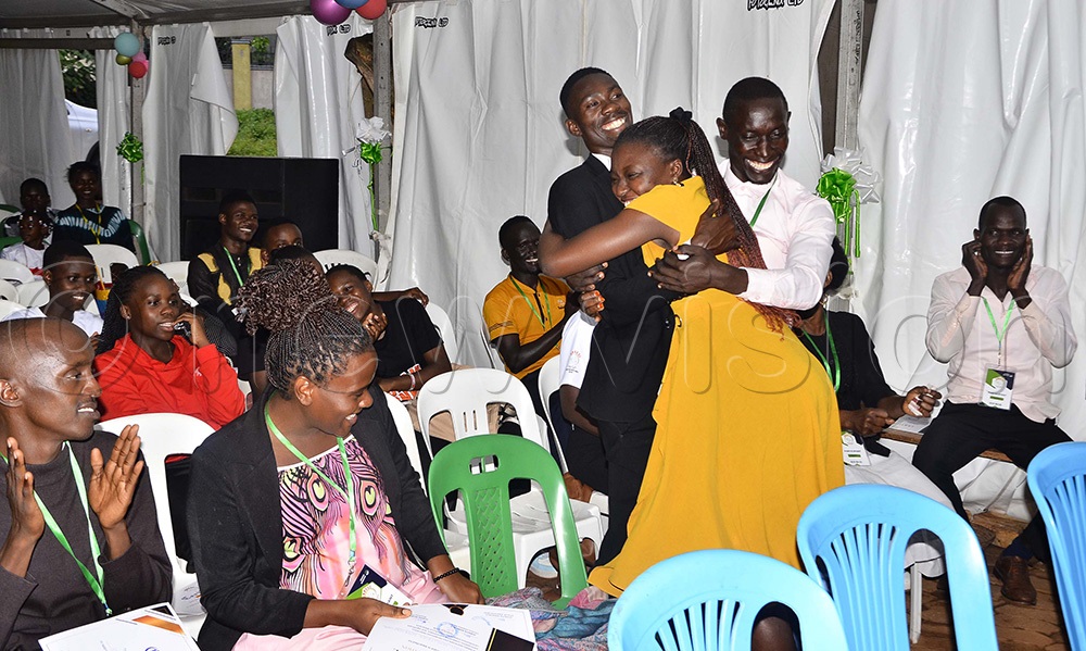 Christians from Healing Power Ministry hug each other as other contestants look on during the award-winning ceremony at Subdue Nations for Christ Church International in Naalya on May 9, 2025. (Photo by Juliet Kasirye)