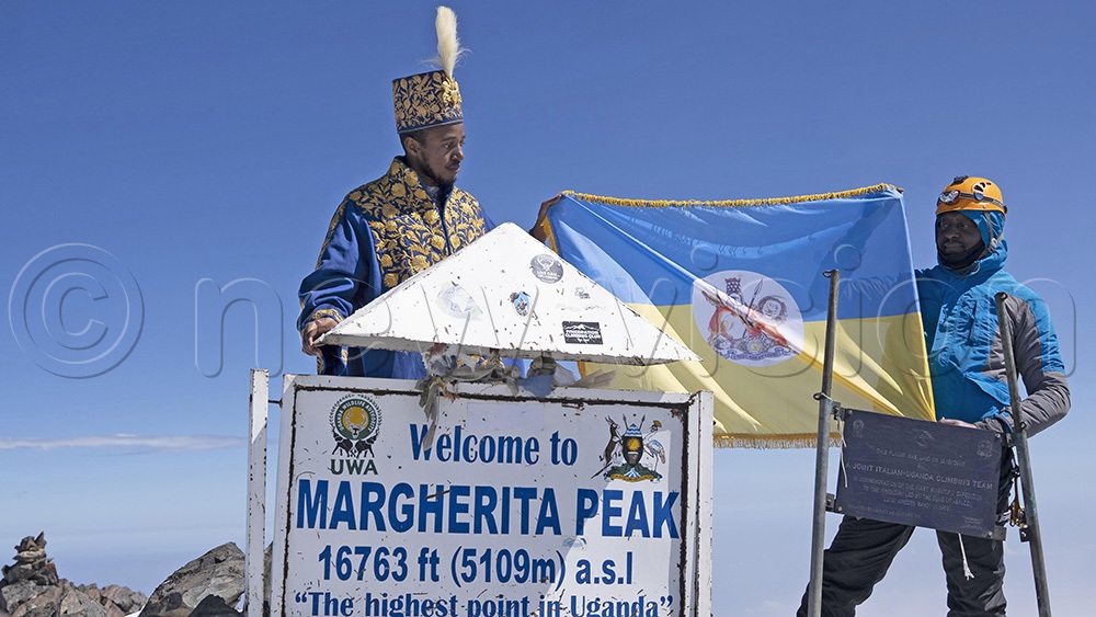 King Oyo Kabamba Iguru (left) and his executive assistant Jonathan Baala at the Margherita Peak upon conquering the 5,109 meters&rsquo; highest peak of Rwenzori Mountains. (New Vision Archives)