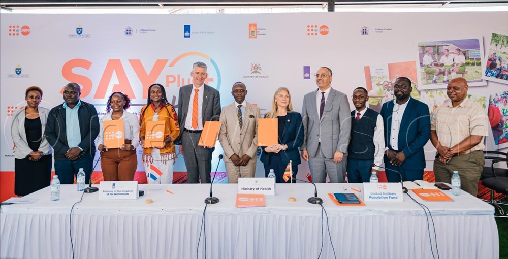officials from UNFPA, Dutch Embassy and other dignitaries pose for a photo after the official signing.