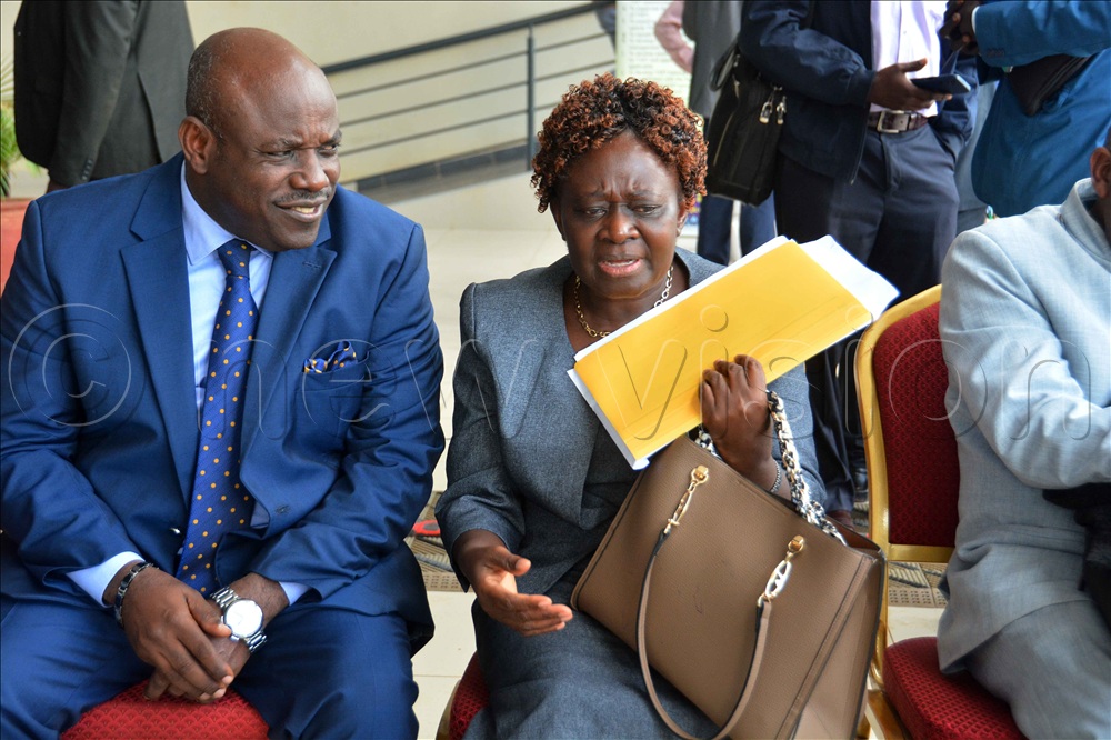 The executive secretary of UVTAB Onesmus Oyesigye (left) interacts with Sarah Namuli the inspector of religious institutions Church of Uganda during the secretaries of religious institutions meeting at Uganda Vocational and Technical Assessment Board headquarters in Kampala on Thursday October 29, 2026. 