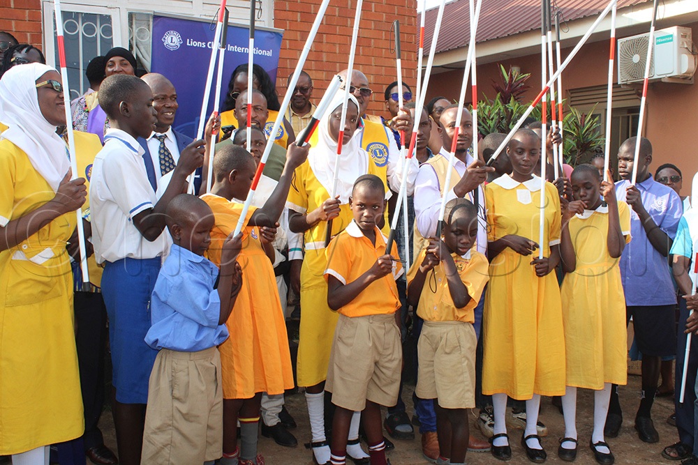 Three schools are among the recipients of the white canes donated by the Lions Club of Kampala East. (Photo by Ritah Mukasa)