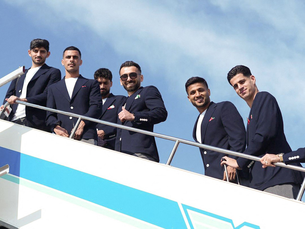 Iran's national team players (From L) defender Mehdi Torabi, left winger Mehdi Ghayedi, midfielder Amirmohammad Razzaghinia, left winger Mohammad Mohebi and goalkeeper Payam Niazmand boarding a plane at Antalya Airport ahead of their departure to Mexico for the FIFA 2026 World Cup football tournament, in Antalya, Turkey, on June 6, 2026. (Photo by Handout / Iran football Federation Press office / AFP)