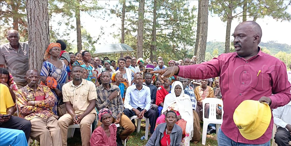 Outgoing Bisheshe division chairman Kanyomozi speaking to the residents.