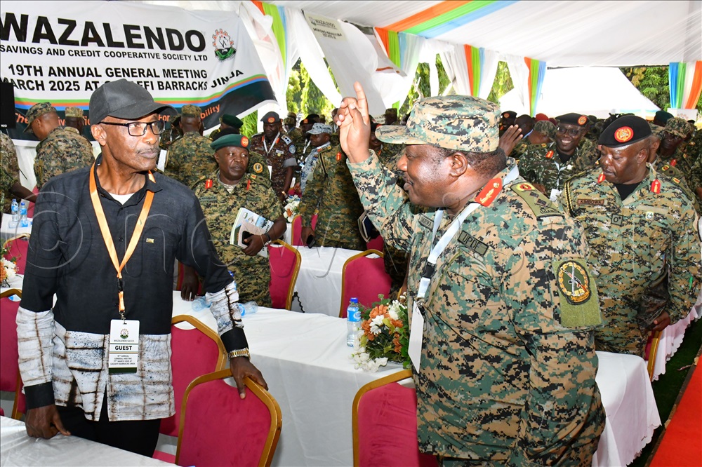 One of WSACCO’s founding members Gen. Kale Kayihura (Left) chatting with the Deputy Commander Land Force, Maj. Gen. Francis Takirwa (Right) after clossure of the WSACCO 19th Annual General Meeting on March 17th at Gaddafi Barracks in Jinja City. 
