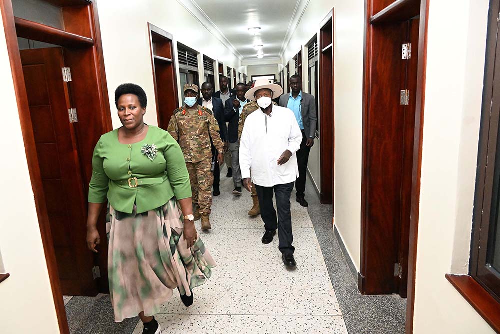   State House Comptroller Jane Barekye (L) takes President Museveni on a guided tour of one of the SFC detach dormitories during its commissioning at Nakasero on Wednesday. (PPU Photos)
