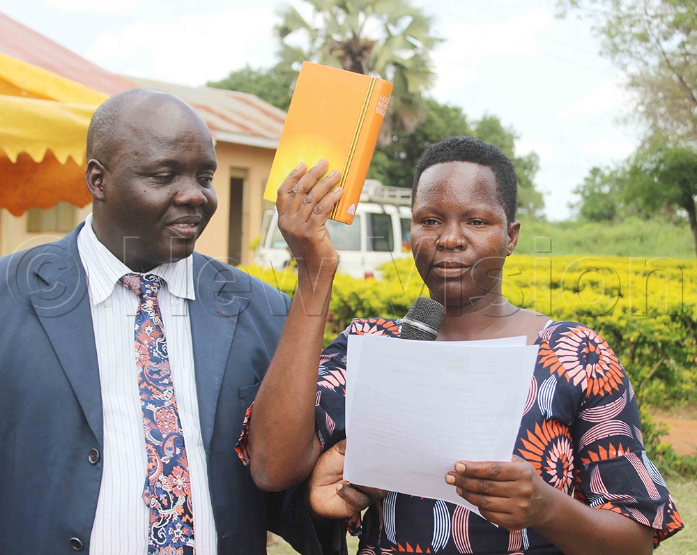 Stella Aino, a secretary for works and technical services of Anyara subcounty as she took her oath. (Photo by Michael Onyinge)