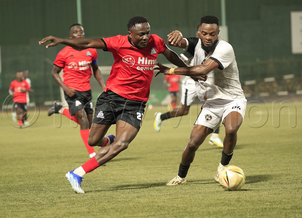 Kelvin Tah contesting for the ball with Gusto Mulongo. (Photo by Ismail Mulangwa)