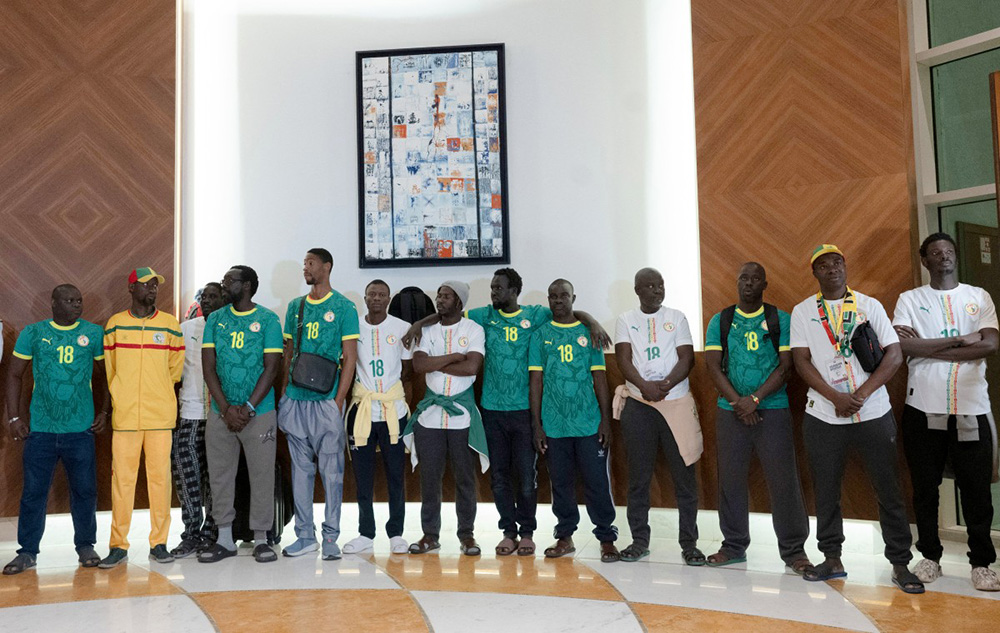 Senegalese supporters who were granted a royal pardon in Morocco arrive at Blaise Diagne International Airport in Ndiass, Senegal on May 24, 2026, after being held in Morocco since the Africa Cup of Nations final. (Photo by SEYLLOU / AFP)