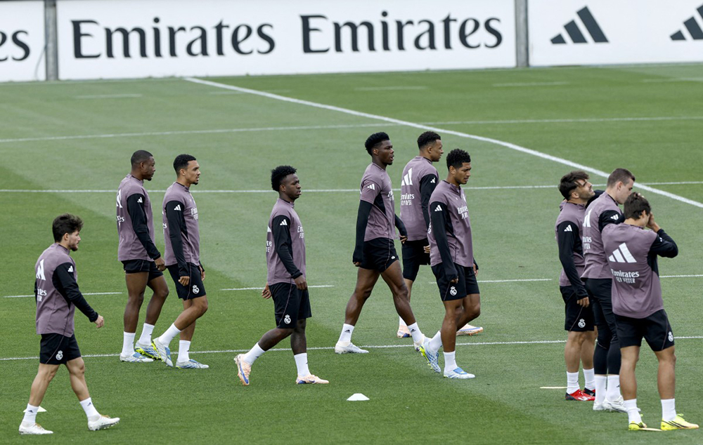 Real Madrid's French midfielder #14 Aurelien Tchouameni (C) and teammates attend a training session on the eve of the Spanish league football match between FC Barcelona and Real Madrid CF, at Real Madrid Sports City in Valdebebas, in the outskirts of Madrid, on May 9, 2026.