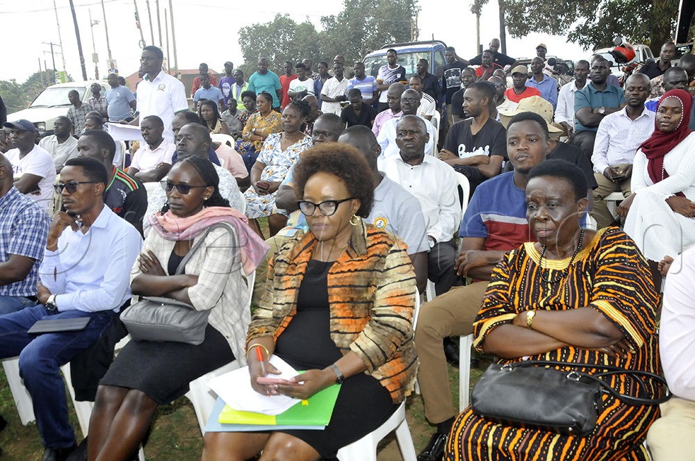 A cross section of Bulindo village residents listen to lands state minister Sam Mayanja as he read out findings of the report of the land wrangle on Block 182, Kira Municipality, Wakiso district on August 27, 2025, where over 3000 land titles were found to be false. (Credit: Wilfred Sanya)  