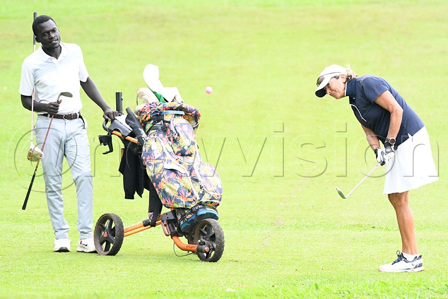 Catherine Pavie chips during the first round of the Seniors Open at the Lugazi Hills Golf and Country Club course, August 22, 2025. Photo by Michael Nsubuga