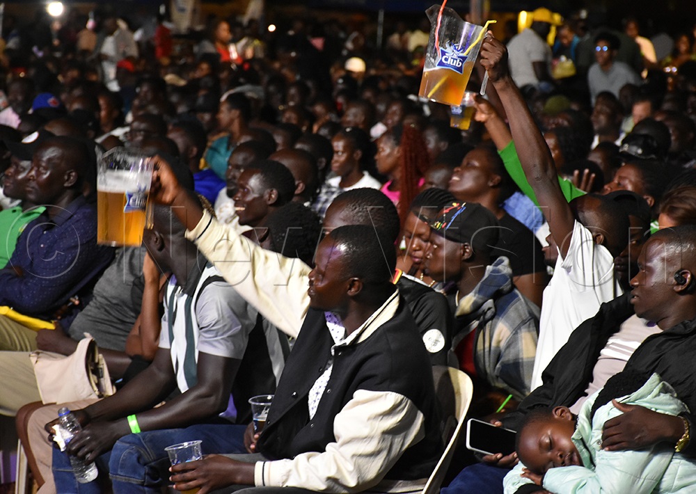 Awilo's daring fans drinking beer in jars. (Photo by Jesse Johnson James)