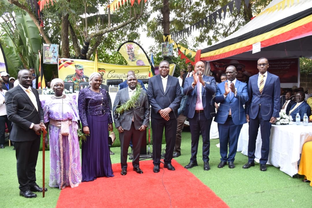 PLU Secretary General Fadul Twaha (4th left), Speaker of Parliament Jacob Marksons Oboth (centre), Michael Mawanda (2nd right), Edwin Karugire (right), and other guests pose for a photo moment during the event on Wednesday, June 24, 2026. (Credit: Simon Peter Tumwine)