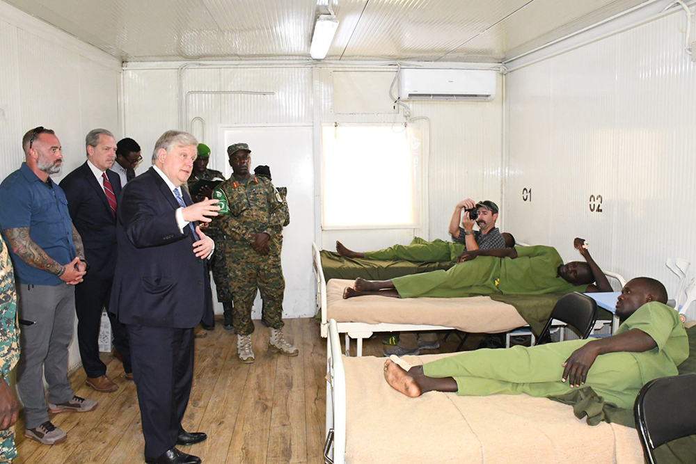US Ambassador to Somalia, H.E. Richard Riley, interacts with UPDF patients at level 11 hospital. (Courtesy)