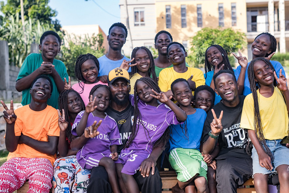 Members of the Ugandan dance group "the Ghetto Kids" pose for a group picture after a day's rehearsal at their home in Nakawuka, Wakiso, Uganda, on May 25, 2026. (Photo by Badru KATUMBA / AFP)