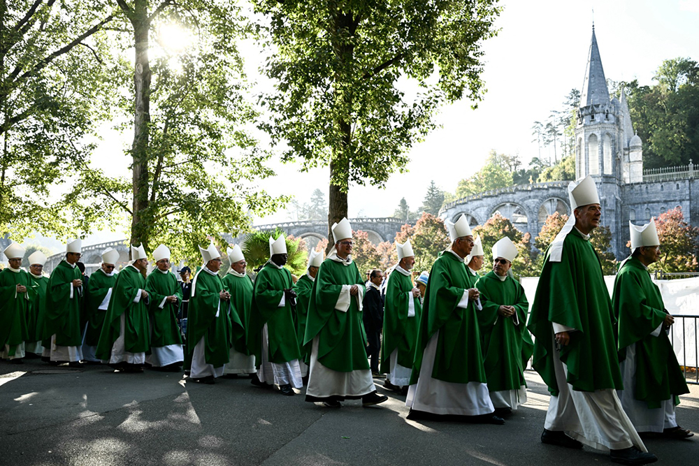 Bishops take part in the procession at the start of a holy mass celebrated by Pope Leo XIV at the Prairie of the Shrine of our Lady of Lourdes, in Lourdes, southwestern France, on September 27, 2026 on the third day of his visit to France.