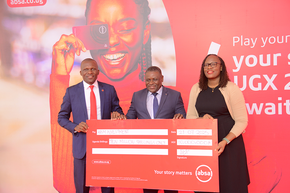 Moses Rutahigwa, Retail and Business Banking Director Absa Bank (left) and Helen Basuta Nangonzi, Absa Bank Uganda's marketing and Customer Experience (right) with Pafra Mulambuzi, Director at ABM.