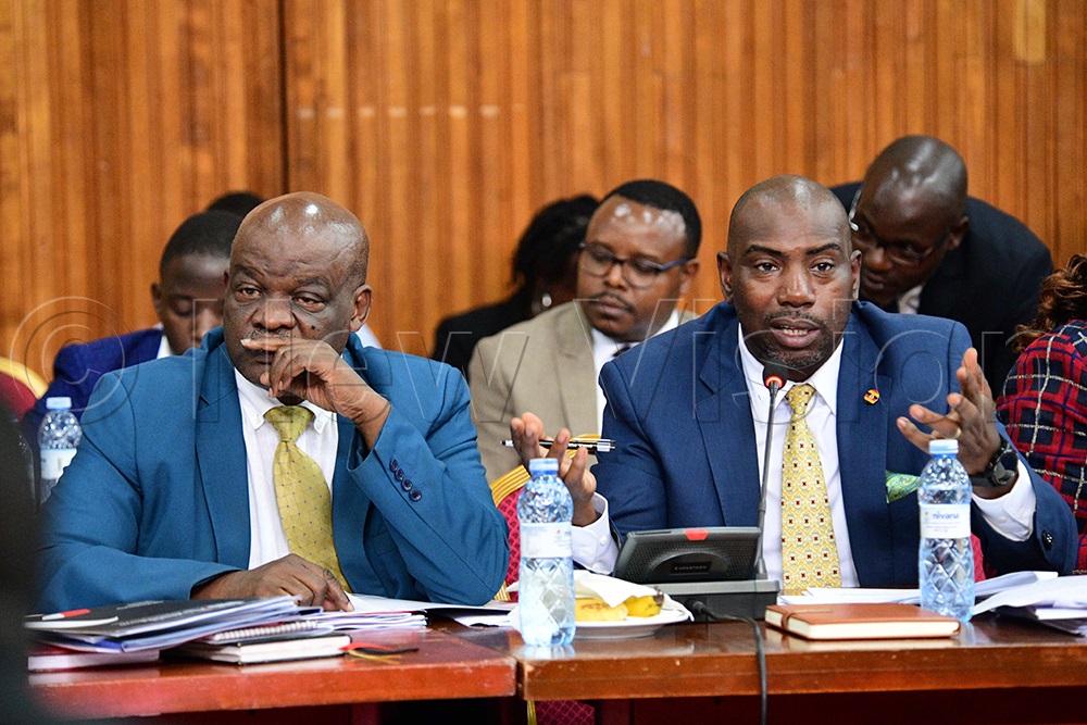 Dickson Kateshumbwa, the Member of Parliament for Sheema municipality and Moses Goli Ogwal MP Dokolo North County during the finance committee of parliament session on April 15, 2026. (Photo by Maria Wamala)