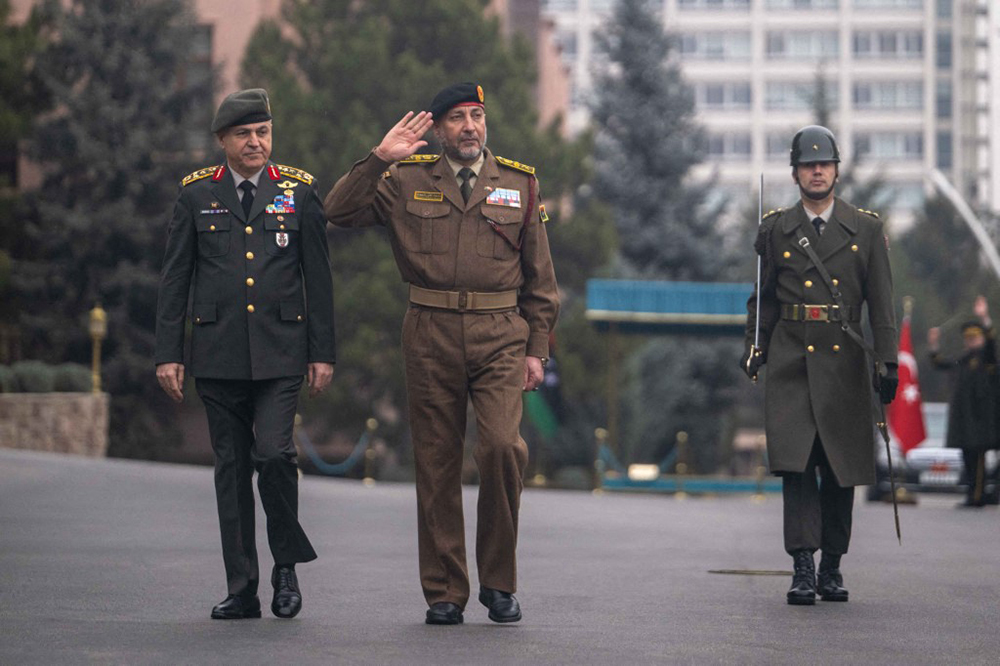 Turkish Chief of General Staff Metin Gurak (L) welcomes Chief of the General Staffof the Libyan Army, Mohammed Al-Haddad (2nd L) with an official ceremony in Ankara, Turkiye on January 23, 2025. (AFP)