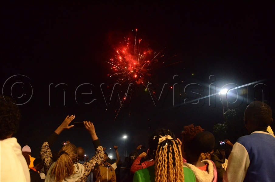 Believers that converged at Miracle Centre Cathedral Rubaga watching fire was that was popped to celebrate the New year 2023. This was at Miracle centre Cathedral Rudaga Kampala on December 31, 2022. 