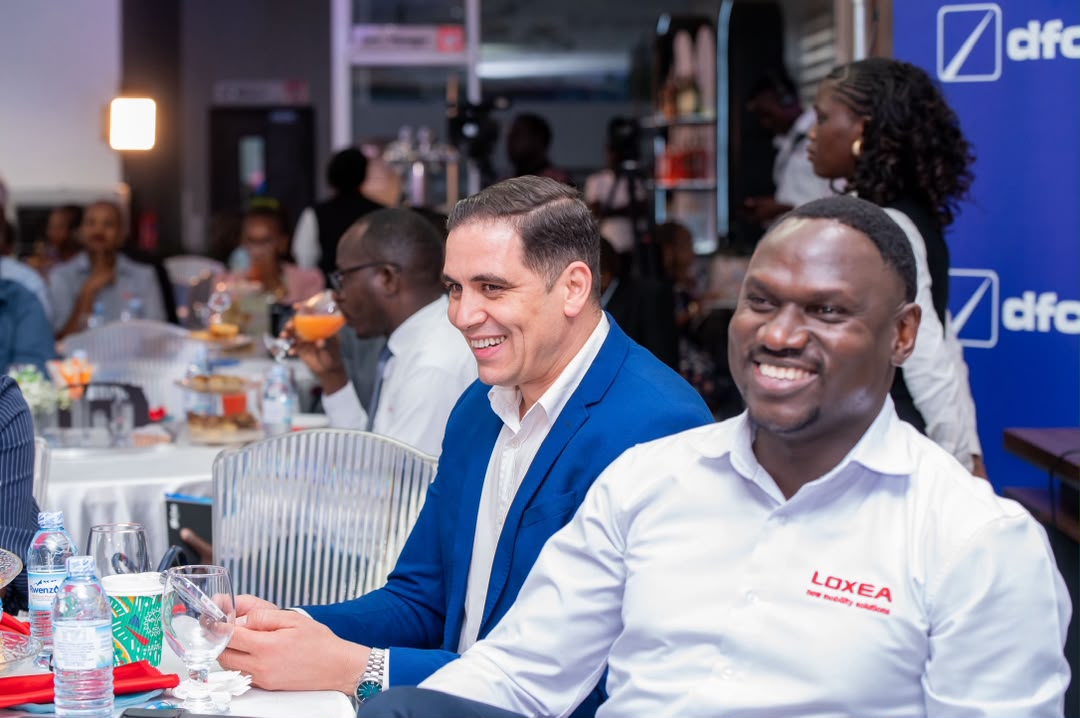 Guests share a light moment during the launch on Thursday.  
