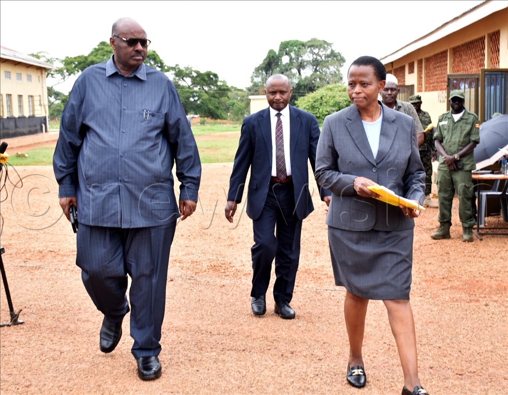 Ben Kumumanya, the permanent secretary of local government  and Lucy Nakyobe, the head of public service inspecting  the National :leadership Institute (NALI) during the human resource manager retreat.