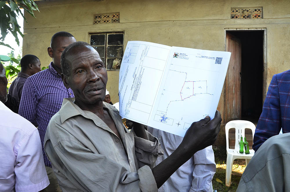 100 squatters get land titles in Mpigi New Vision Official