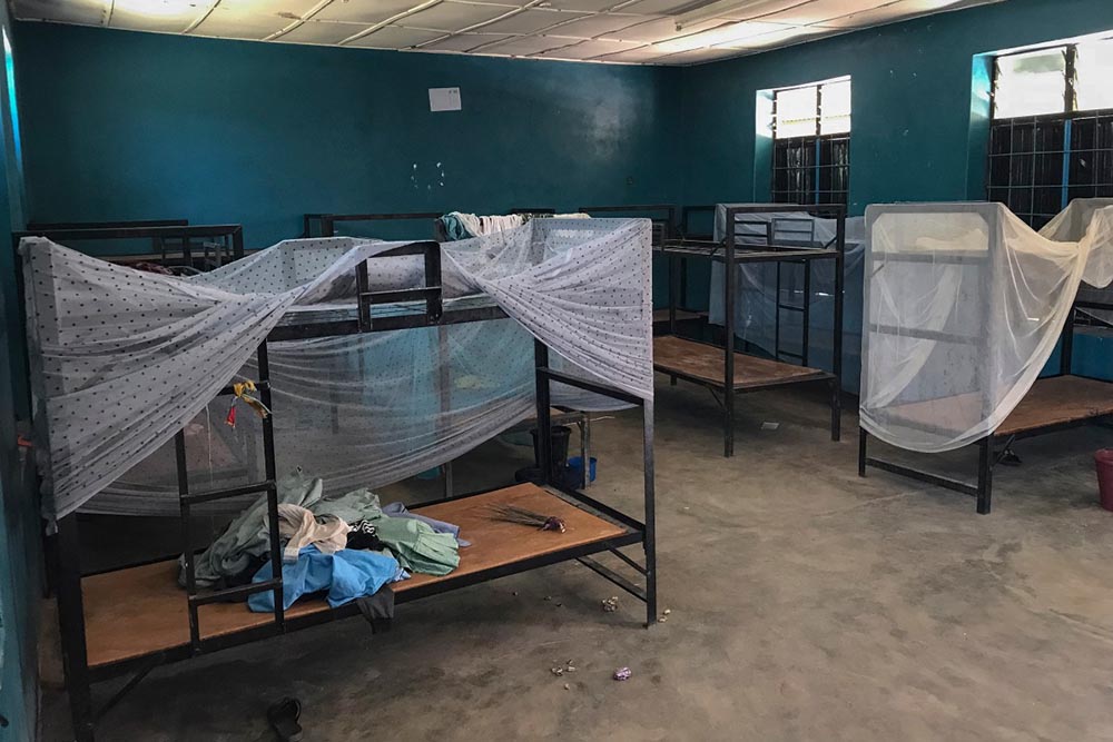 A general view of empty bunk beds and scattered belongings inside a student dormitory at St. Mary’s Catholic School in Papiri, Agwarra local government, Niger state, on November 23, 2025. Fifty of the more than 300 children snatched by gunmen from a Catholic school in Nigeria have escaped their captors, a Christian group said in a statement on November 23. (Credit: AFP)