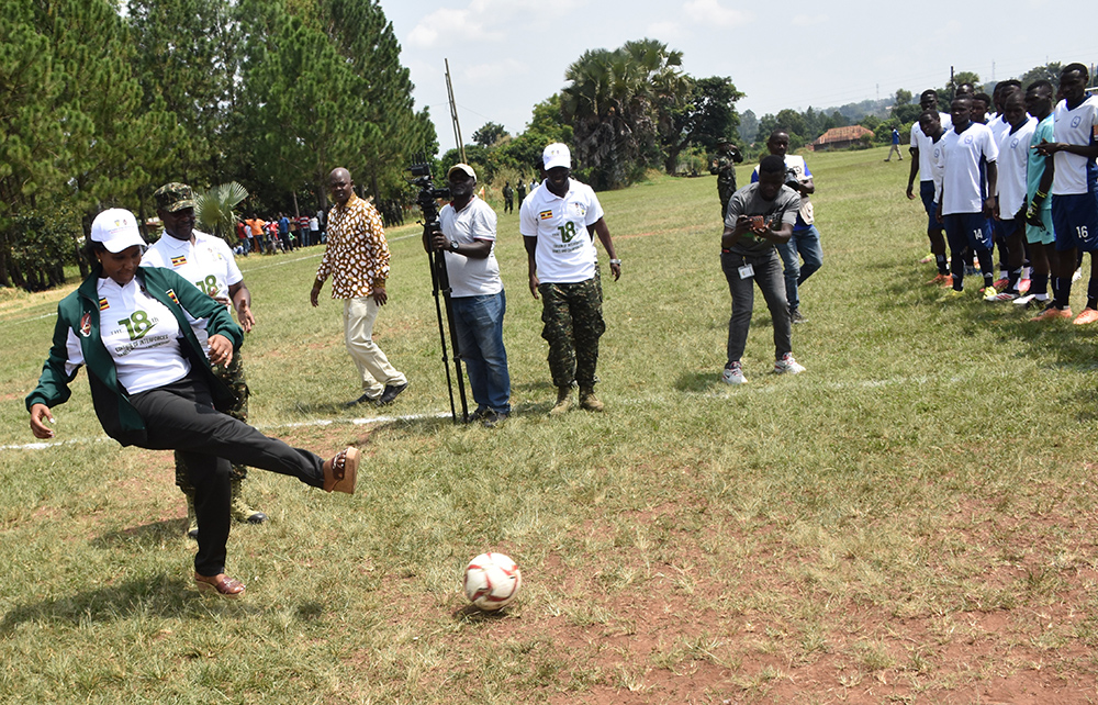 Defence state minister Grace Akifeza Ngabirano kicks the ball to open the final game.