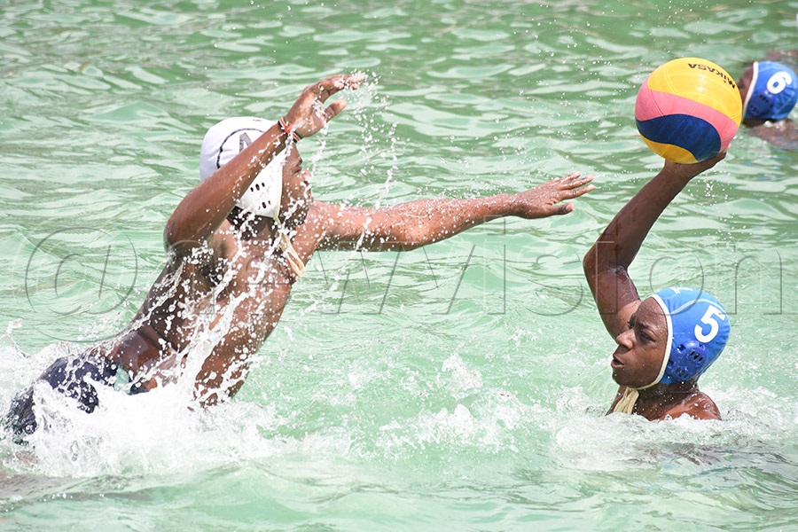 Juniors action between Elite High School (blue caps) and the Shree Sahajanand School during the 4th Uganda National Waterpolo Championships at the Elite High School pool. Photo by Michael Nsubuga