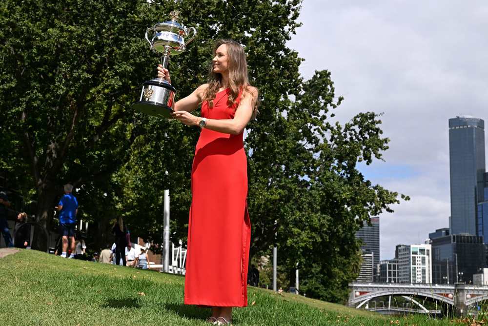 Kazakhstan's Elena Rybakina poses with the Daphne Akhurst Memorial Cup on the bank of the Yarra river in Melbourne on February 1, 2026, following her victory over Belarus's Aryna Sabalenka in the women's singles final of the tennis tournament. (Photo by WILLIAM WEST / AFP)