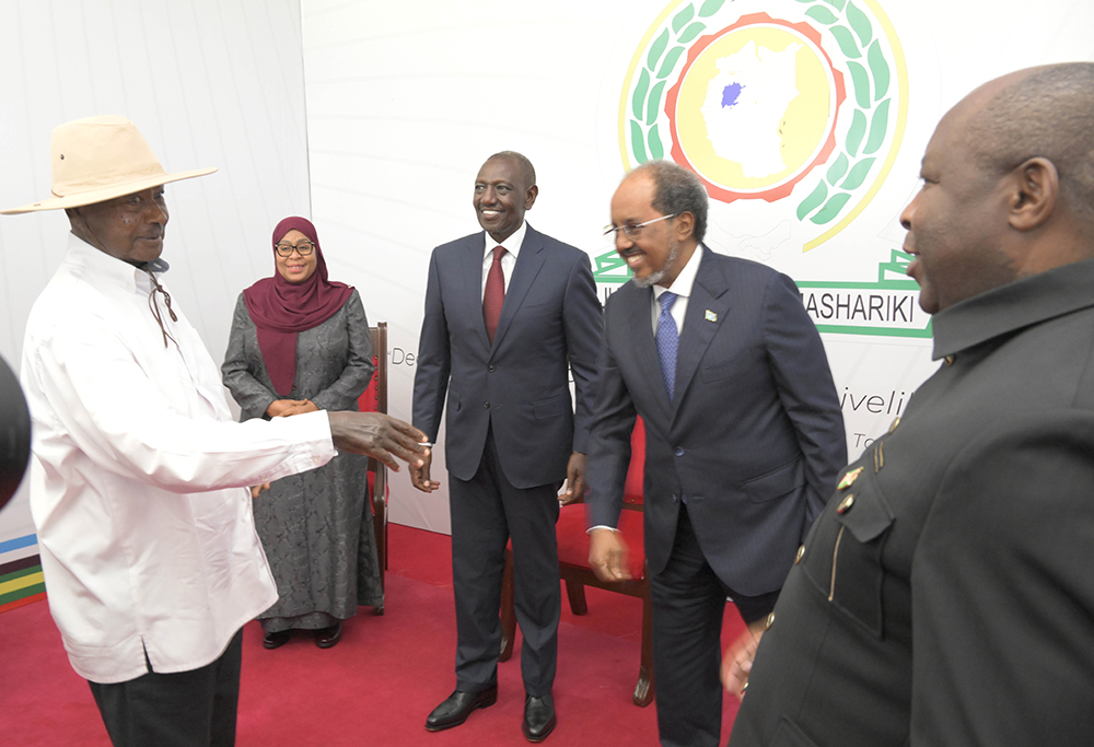President Museveni greeting Hassan Sheikh Mohamud of Somalia.