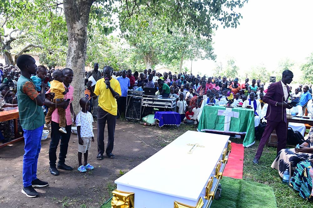 The relatives with children of the deceased as they were introduced to the mourners at the school as the coffin containing the body of their dad lied before mourners. (Credit: Godfrey Ojore)