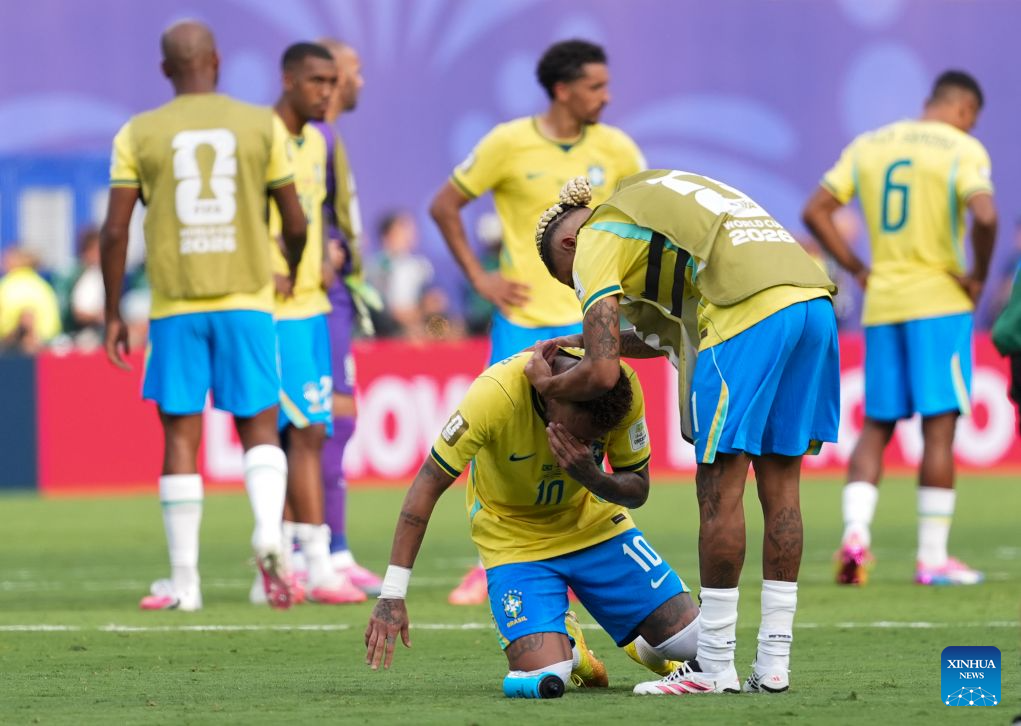 Neymar (bottom) of Brazil covers his face in tears after losing the round of 16 match between Brazil and Norway at the 2026 FIFA World Cup at the New York New Jersey Stadium, the United States, July 5, 2026.