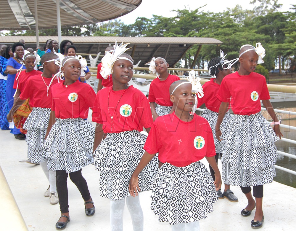 Children in a liturgical dance action during mass. (Photo by Mathias Mazinga)
