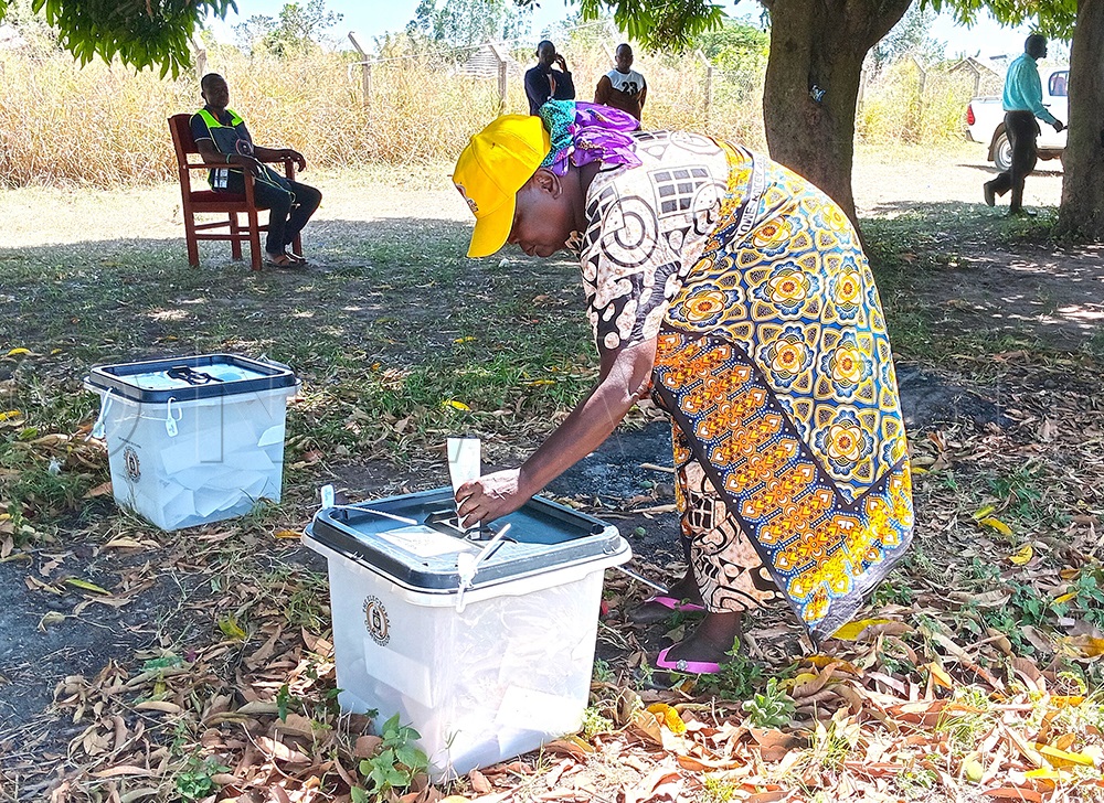 Mary Putan, who is an NRM candidate contesting for the female workers district councilor, casting her vote at the electoral commission headquarters in Kapelebyong district. (Photo by Alfred Atwau)