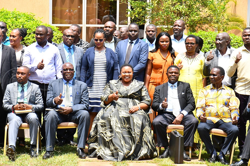 The Minister for Presidency, Milly Babirye Babalanda (seated middle)v flanked by Daudi Migereko (seated right) and Jonah Jackson Bakalikwira (seated 2nd left), in a group photograph with RDCs after closing their workshop at Source of the Nile Hotel in Jinja City on August 19th. (Photo by Donald Kiirya)