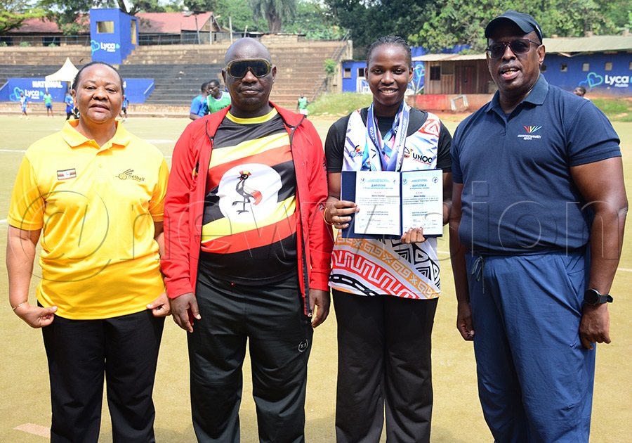 Nasiimu Muteesi poses with her Russian Diploma and medals alongside Netball Uganda president Jocelyn Ucanda (left), Rashid Mubiru and UOC president Donald Rukare at Lugogo, June 28, 2026. Photo by Michael Nsubuga