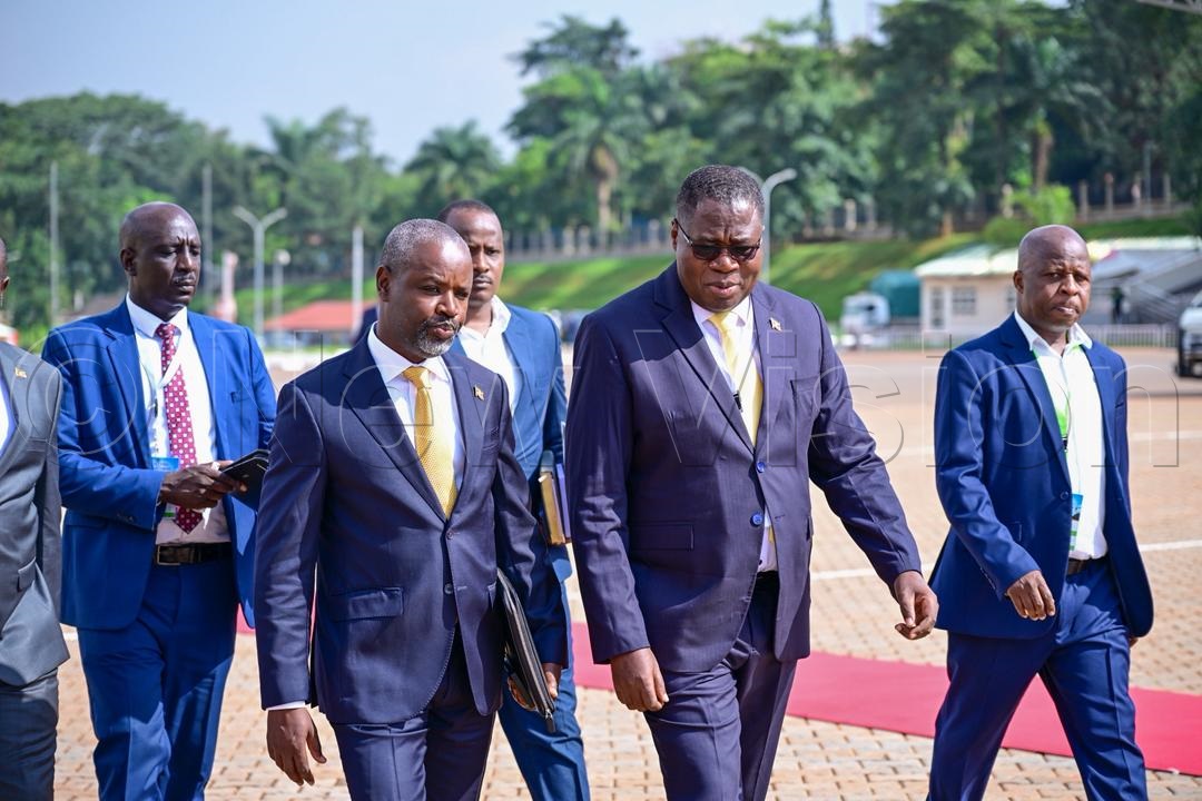Jacob Oboth-Oboth with outgoing speaker of parliament, Thomas Tayebwa.